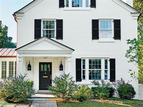 white houses with black shutters